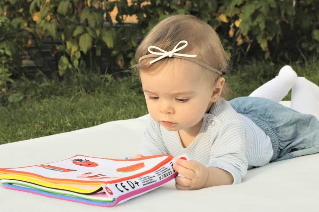 a baby and book